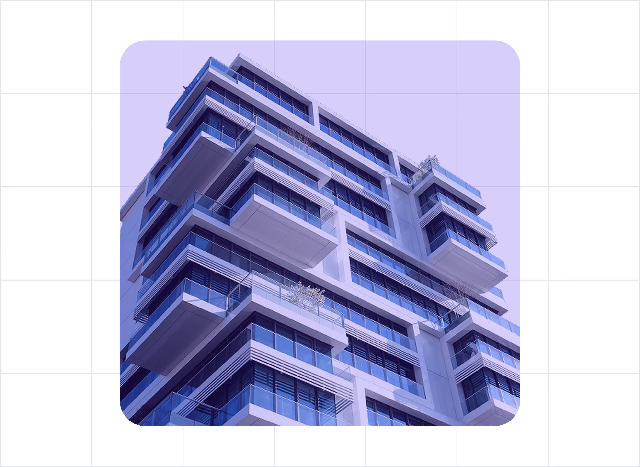 Low-angle view of a modern multi-story apartment building with glass balconies against a clear blue sky.
